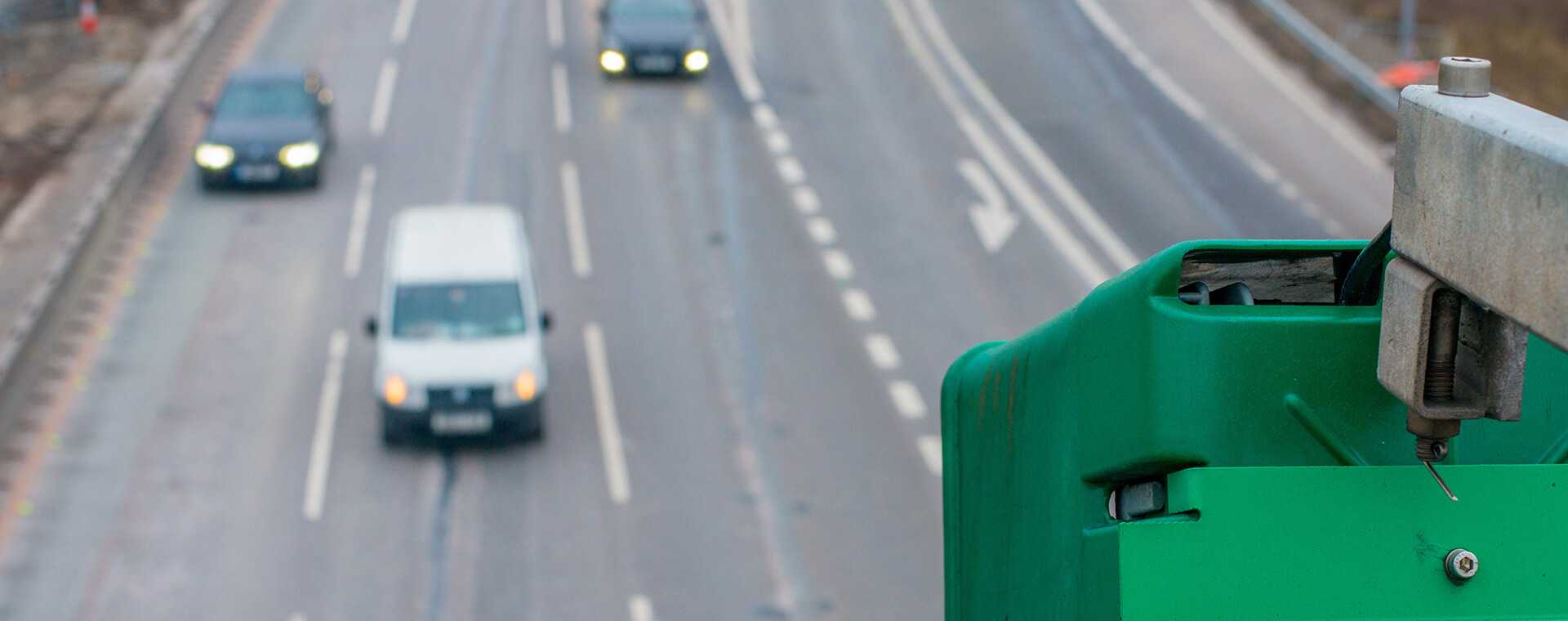 Two people in hi-vis counting traffic.